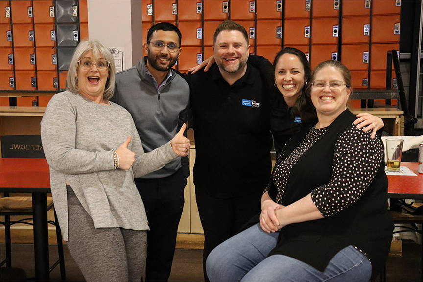 Group members strike a pose at team bowling night